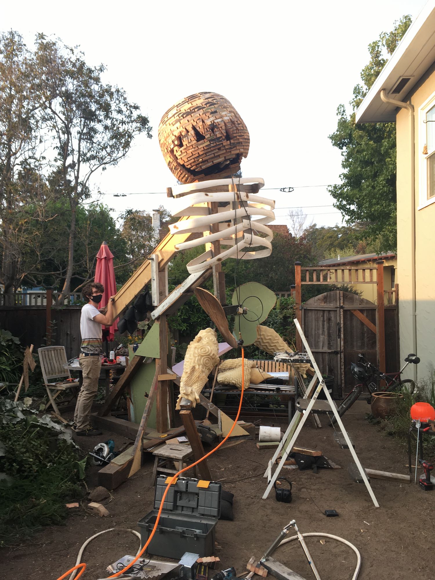 An in-progress Pumpkin Man standing up